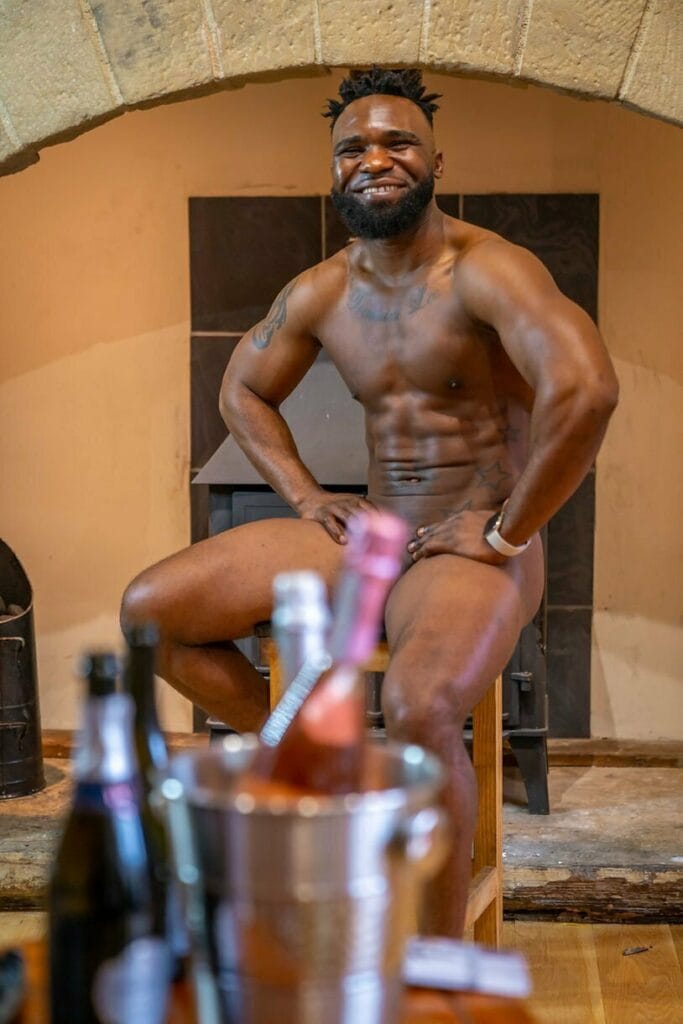 A butler in the buff behind the bar in Liverpool