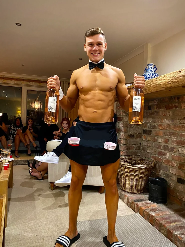 Hen party group with a butler in the buff in Edinburgh