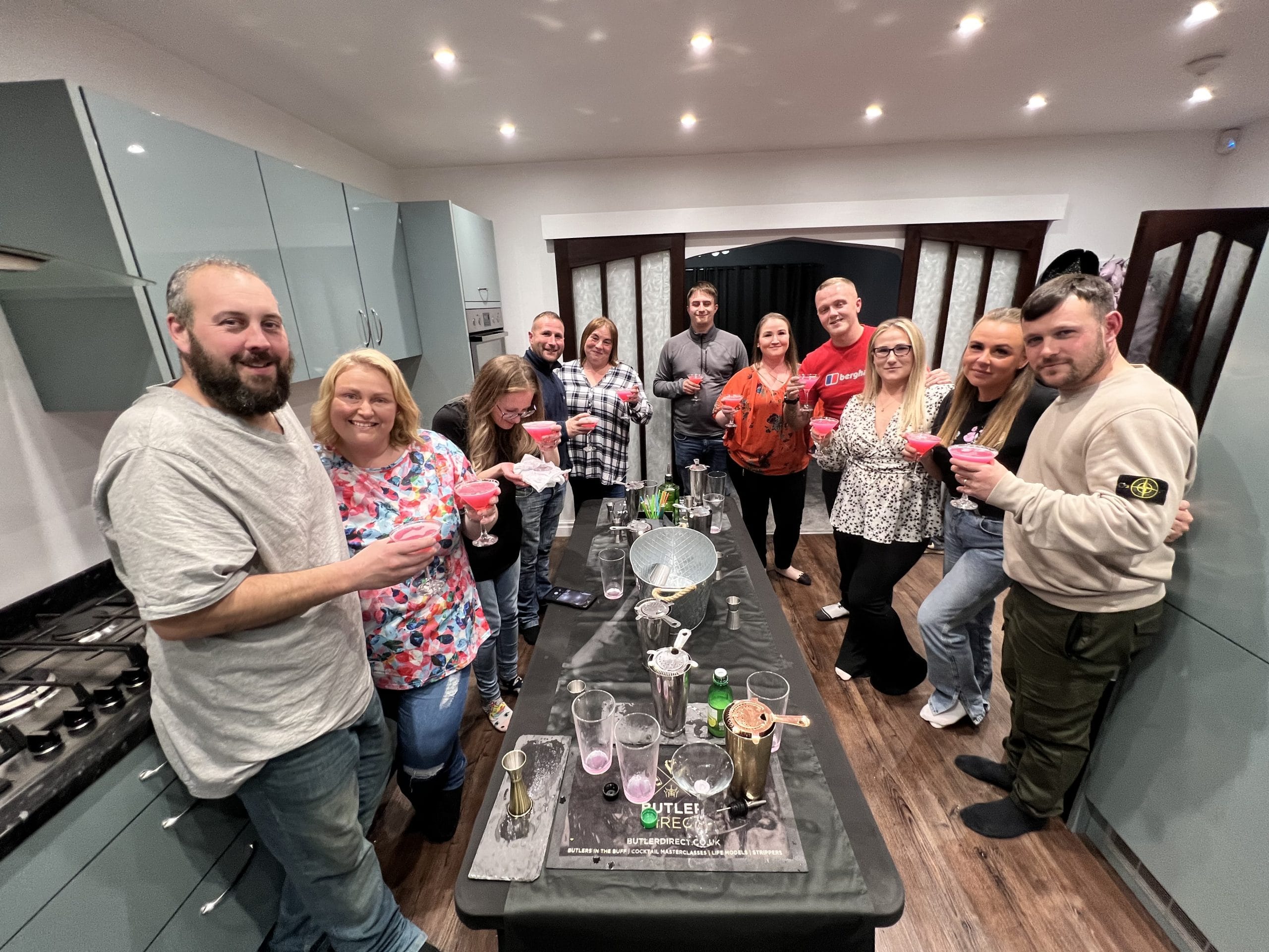 Guests raising the cocktails they made at a Butler Direct masterclass