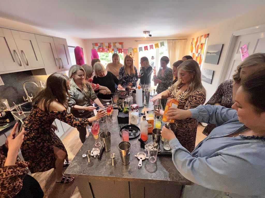 A hen party group making cocktails together at a Butler Direct party